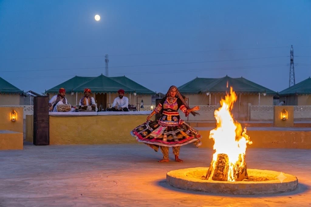 Desert camp lit for an evening gathering